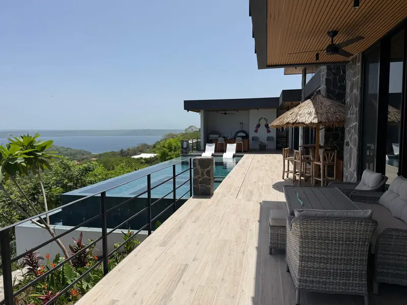 Saltwater pool, terrace, and Pacific view from a partner luxury home in Playa Hermosa